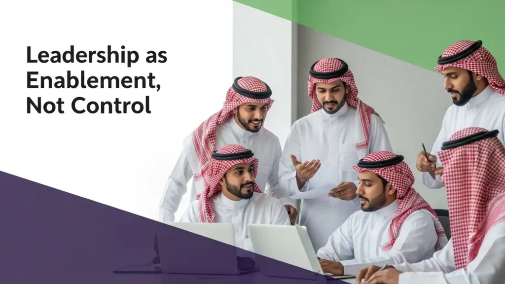 Collaborative employees illustrating leadership as enablement to foster innovation and effective teamwork in a modern office.