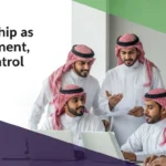 Collaborative employees illustrating leadership as enablement to foster innovation and effective teamwork in a modern office.