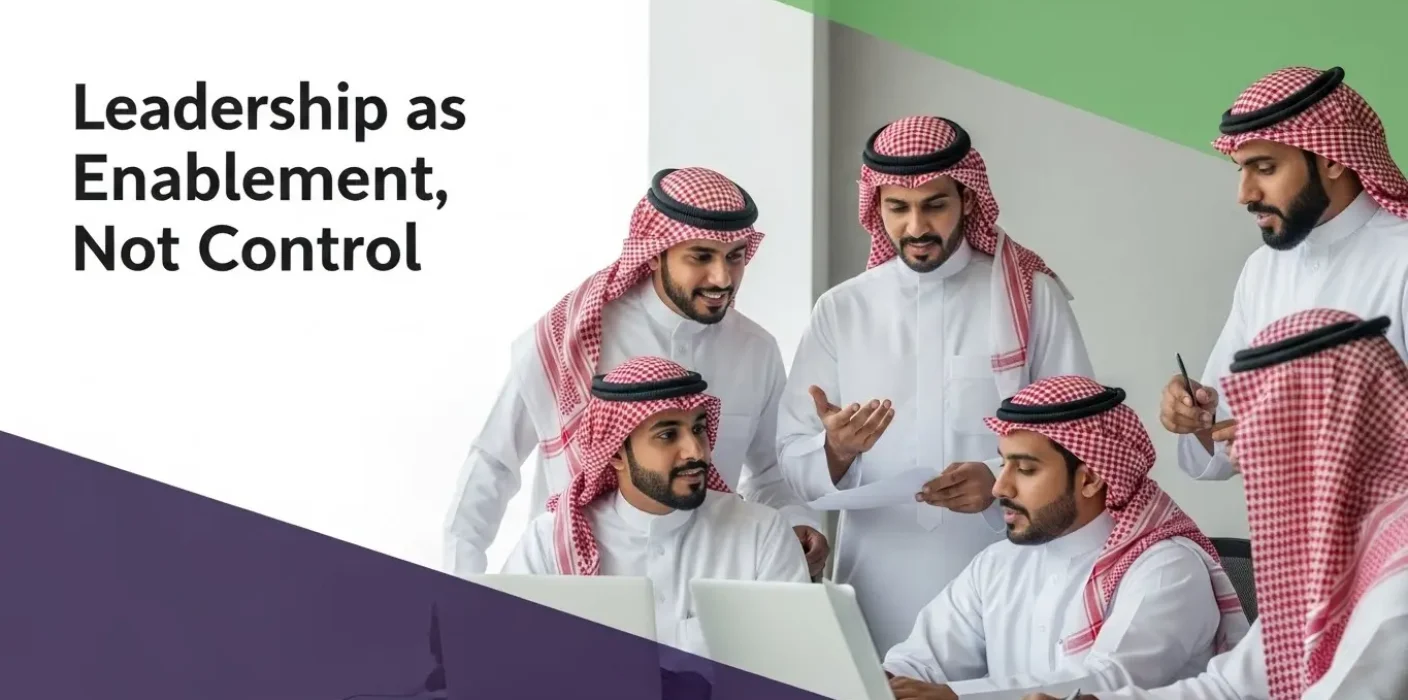 Collaborative employees illustrating leadership as enablement to foster innovation and effective teamwork in a modern office.